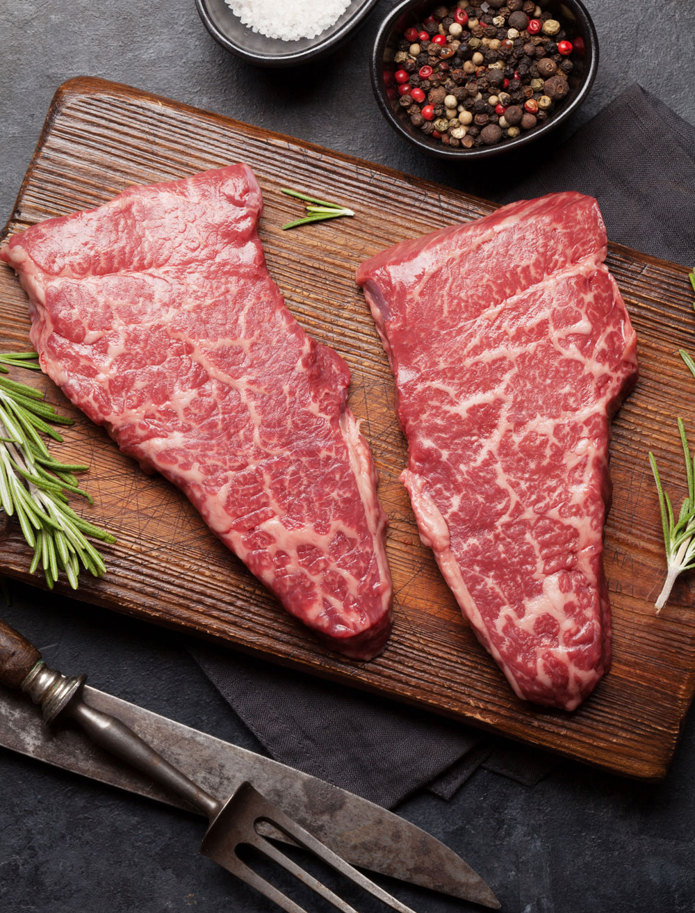Natural Beef Steaks on Cutting Board